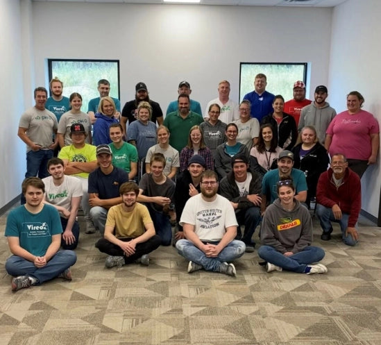 Vireo Resources employees sitting and standing in a large group.