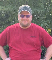 A Vireo Resources employee wearing a red shirt.
