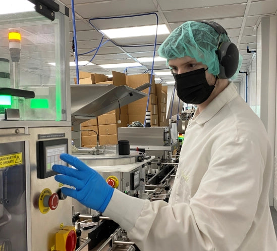 A Vireo Resources employee wearing safety clothing inside the manufacturing facility.